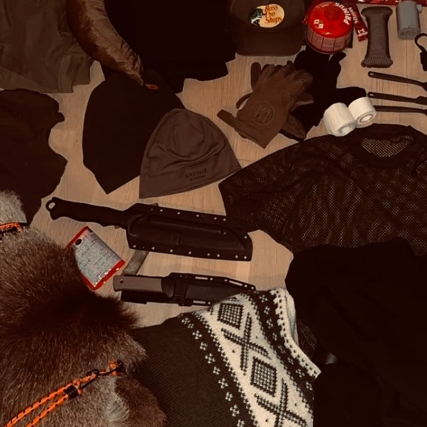 Hiking gear laid out on the floor